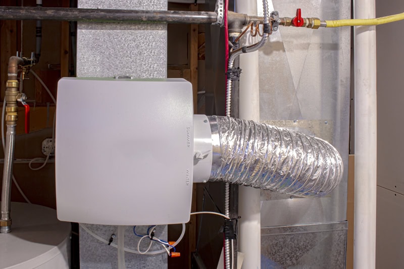 Humidifier on the side of a furnace.